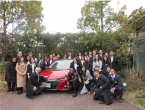 IDJ students around Toyota car