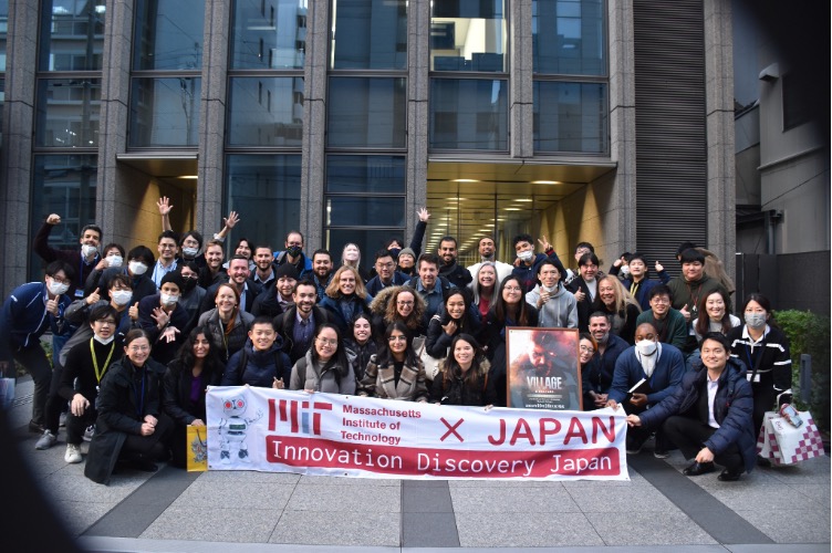 Students and Capcom staff gathered outside the Capcom offices with the MIT x Japan banner. 